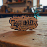 Close-up of the All-American Troublemaker leather hat patch