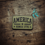 Close-up of the engraved America Since 1776 leather hat patch