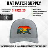 UV printed hat patch with a bear silhouette in a mountain hunting scene