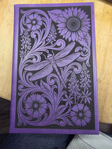 Close-up of the laser engraved cover on the leatherette journal