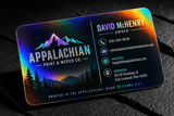 Holographic business cards fanned out to show the printed design