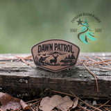 Leather hat patch with a Dawn Patrol sunrise hunting scene