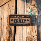Laser engraved leather hat patch reading Don't Pet the Crazy