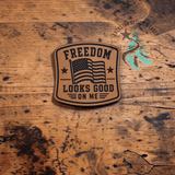 Close-up of the engraved Freedom Looks Good on Me leather patch
