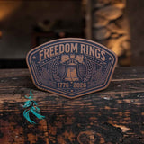 Freedom Rings 250 Years leather hat patch shown at an angle