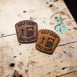 Laser engraved leather hat patch reading Half Saint Half Saloon