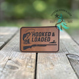 Close-up of the engraved Hooked and Loaded leather hat patch