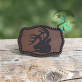 Close-up of the buck silhouette on the linen leather hat patch