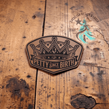Close-up of the engraved Petty Since Birth leather hat patch