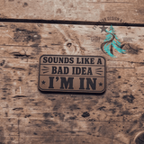 Sounds Like a Bad Idea leather hat patch shown at an angle