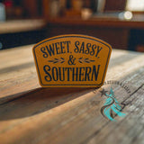 Leather hat patch reading Sweet, Sassy and Southern in country styling