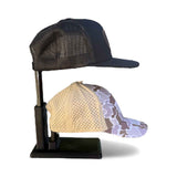 Tabletop display stand that holds two hats for retail counters and vendor booths